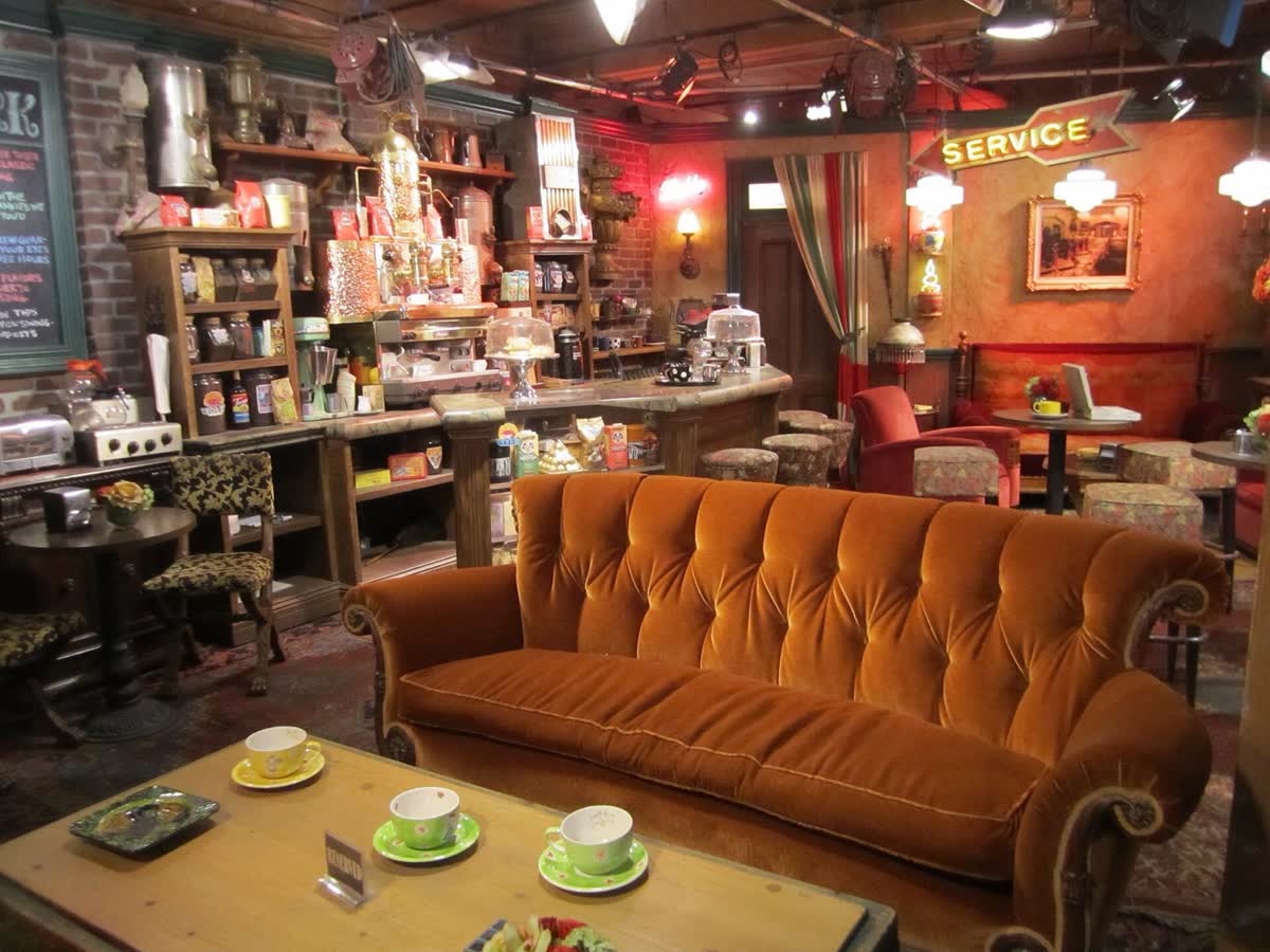 The inside of Central Perk, with the couch in front of the counter
